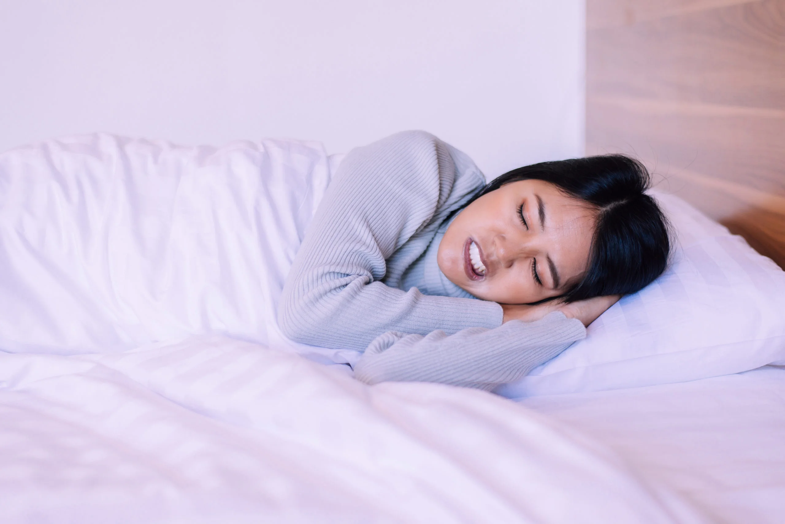 Woman grinding and clenching teeth in sleep